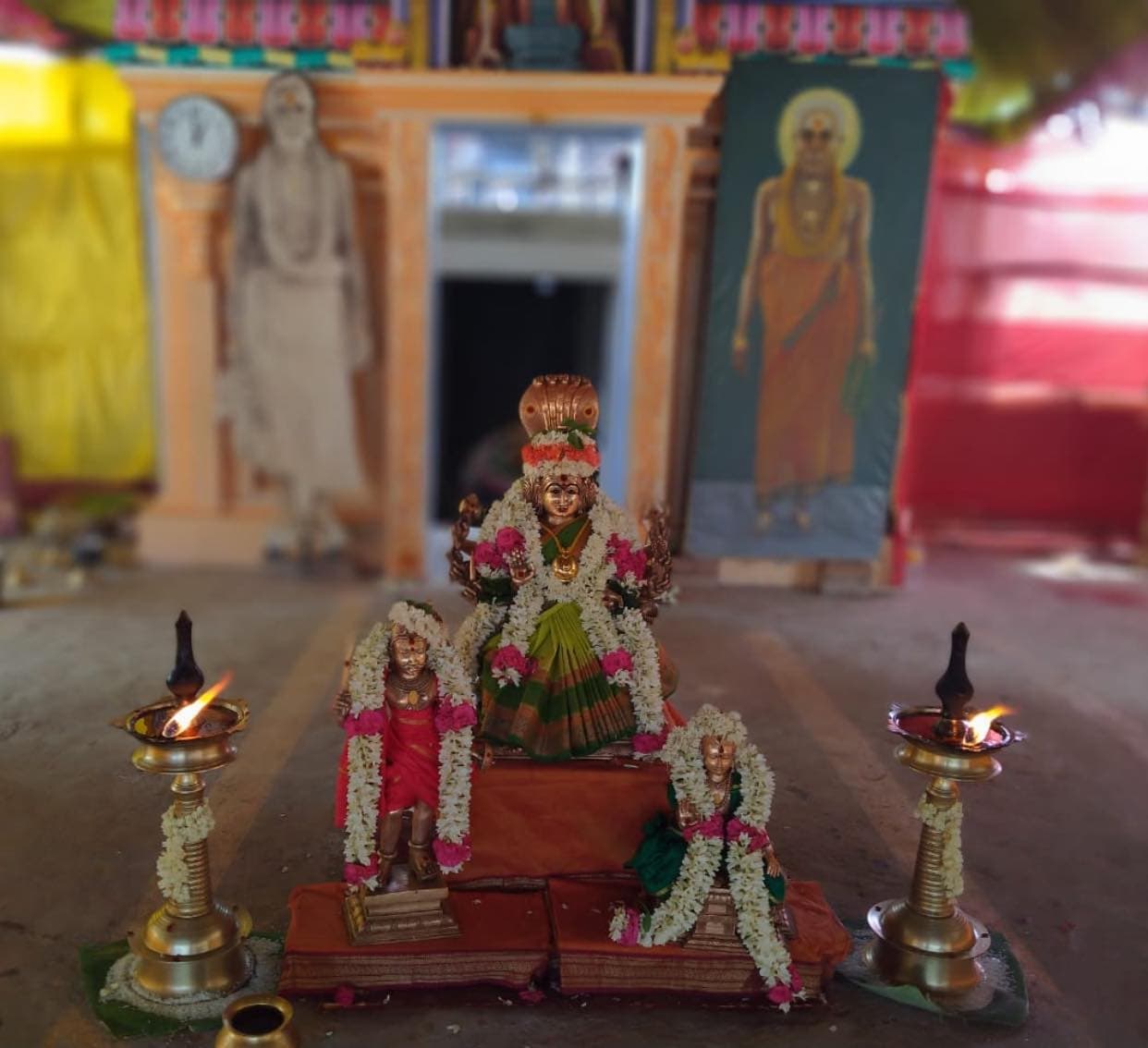 Devi, accompanied by her two guardians—Lord Sri Muthuveeraswamy and Lord Sri Kaathavarayaswamy with the divine grace