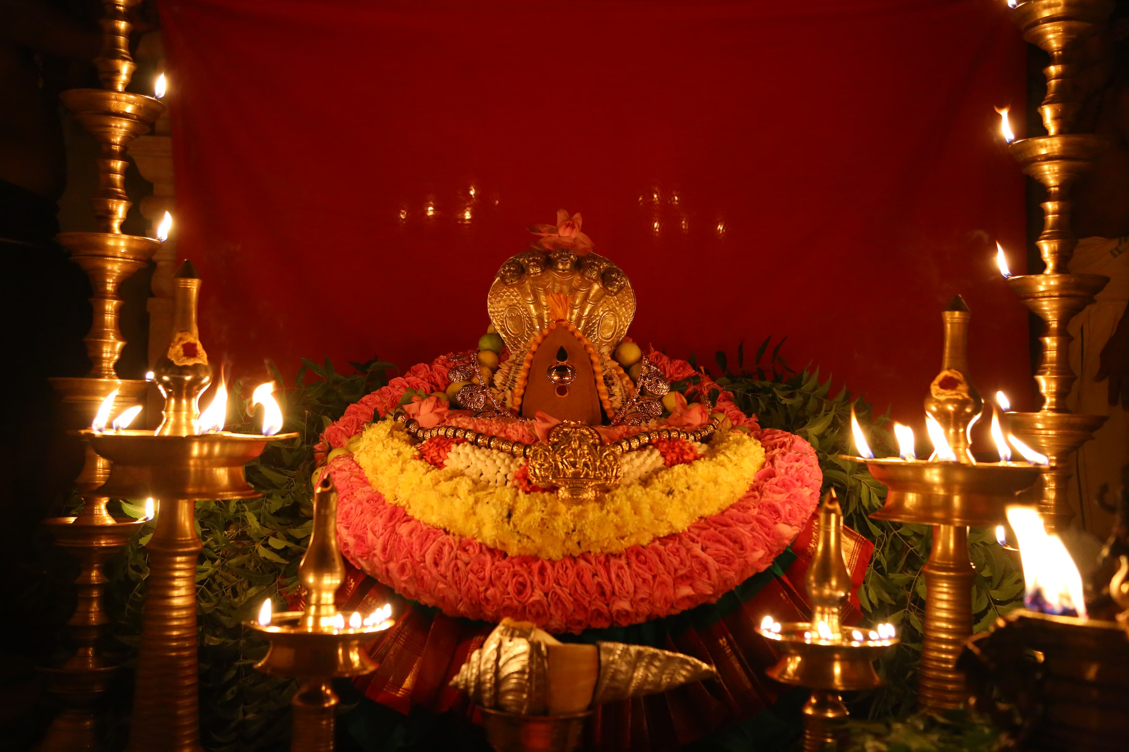 Swayambu form of Devi with sacred Chandan Kaapu, worshipped with devotion.