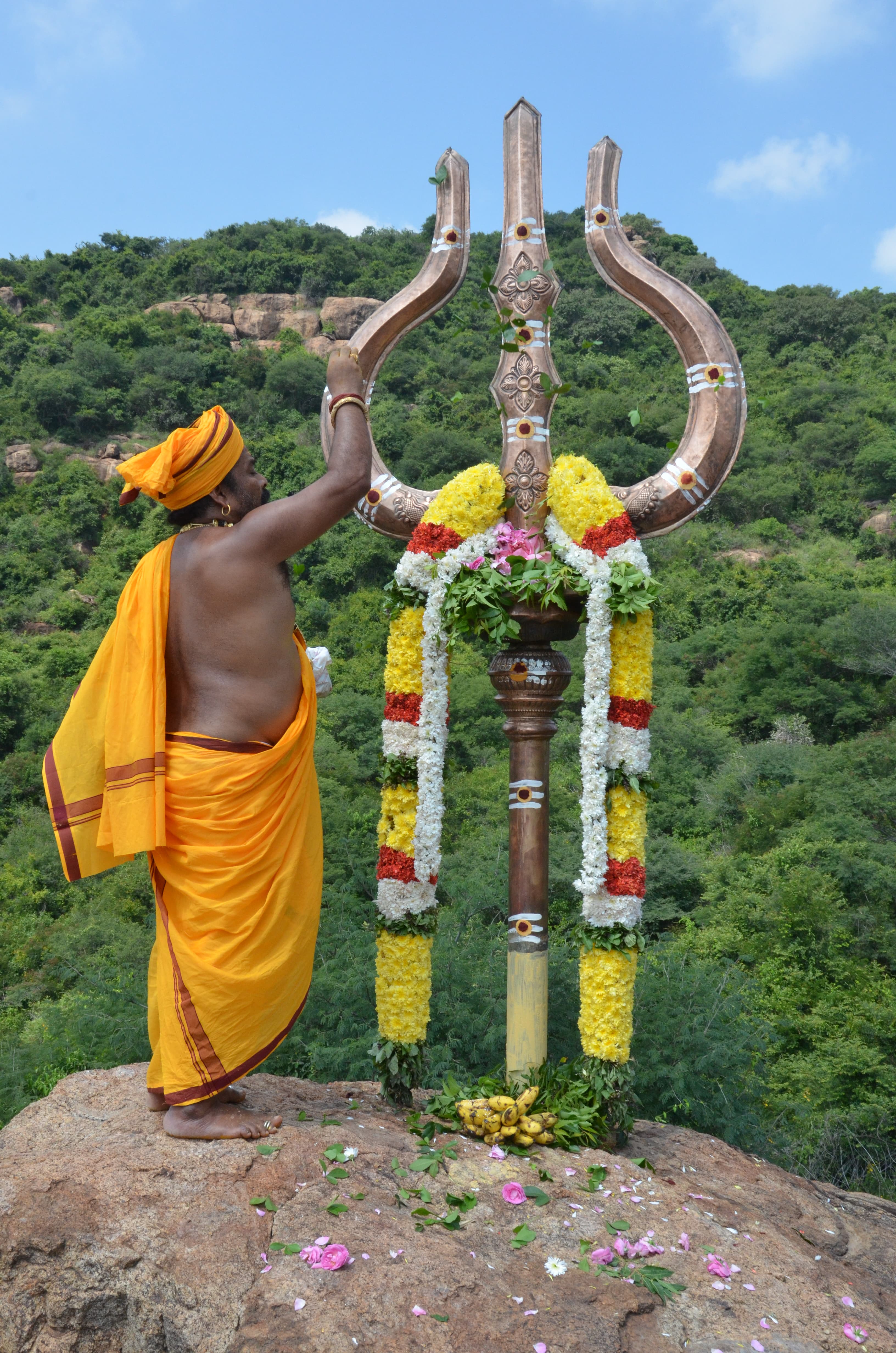 Swamiji performing Trishul Pooja in the sacred hills where Devi placed Her divine feet — Thirupadham.