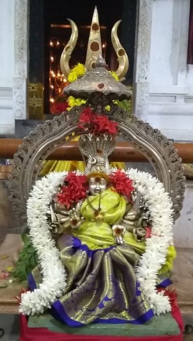 The radiant silver moorthi of Devi Sri Karumaari Amman, embodying her divine grace and protective power.